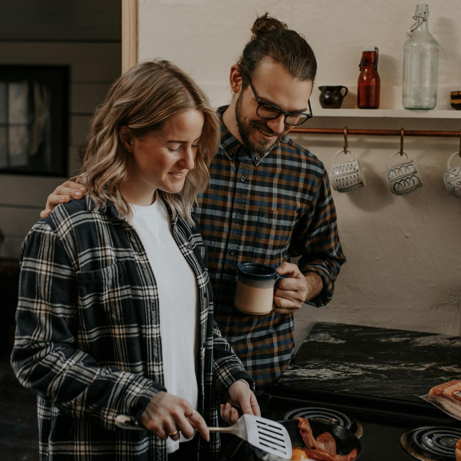 Community members collaborating in a modern kitchen space, sharing recipes and cooking techniques